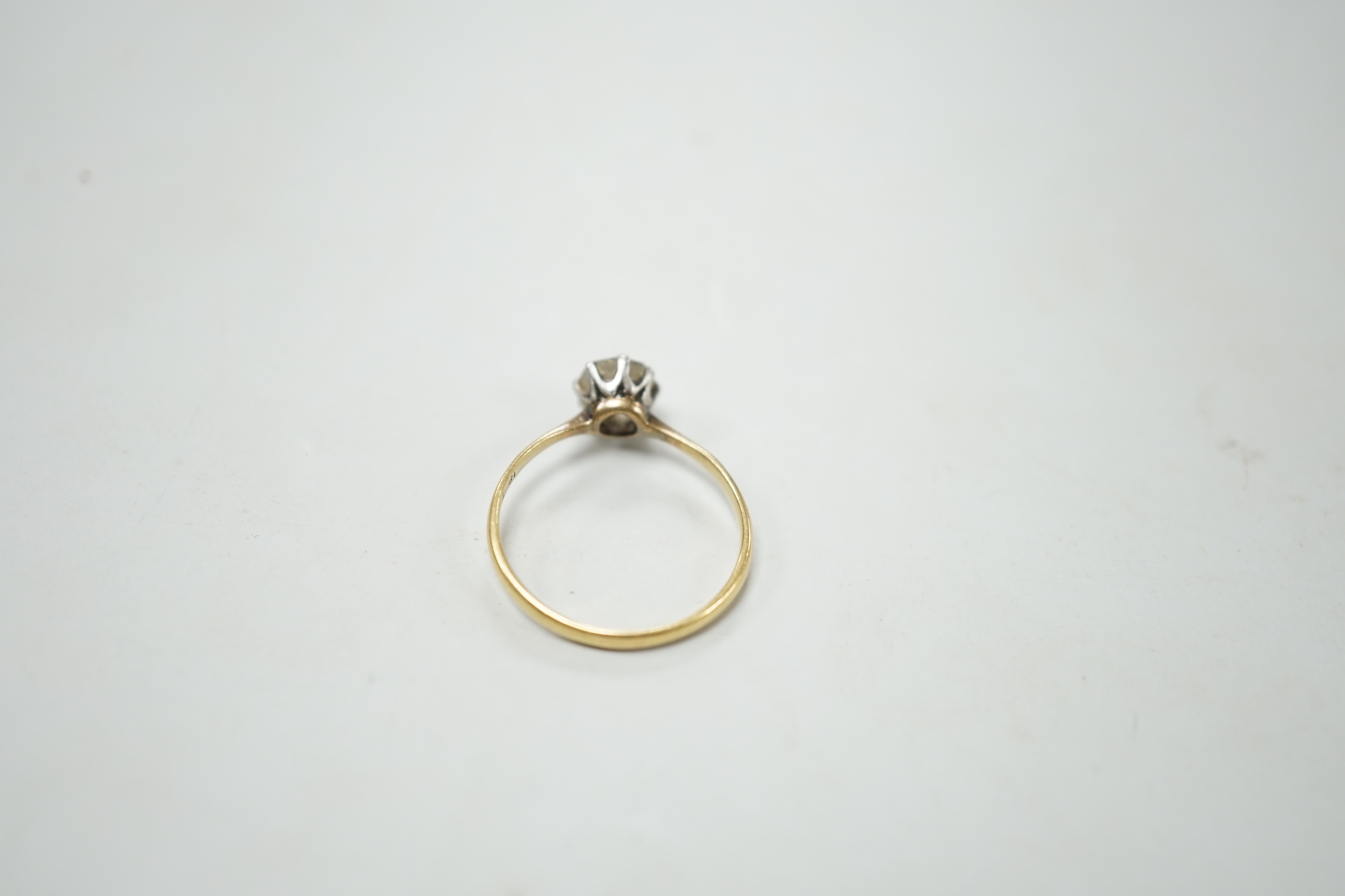 An 18ct, plat and solitaire diamond ring, size M/N, gross weight 1.8 grams, the stone measuring approx. 6.0mm by 5.2mm.